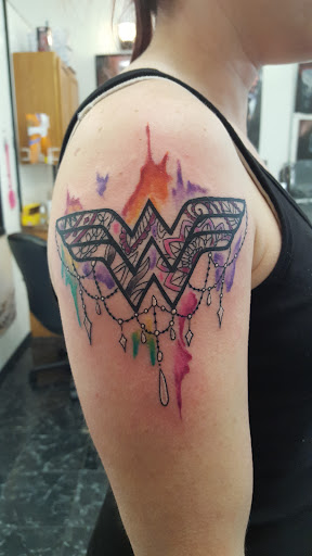 Explore lower back tattoo ideas, creative tattoo ideas in Rogers, available at Saved by Grace Tattoo Studio