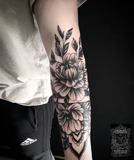 Explore rose tattoo ideas for women, creative tattoo ideas in Cornelius, available at Dermal Designz Tattoo and Piercing Inc.
