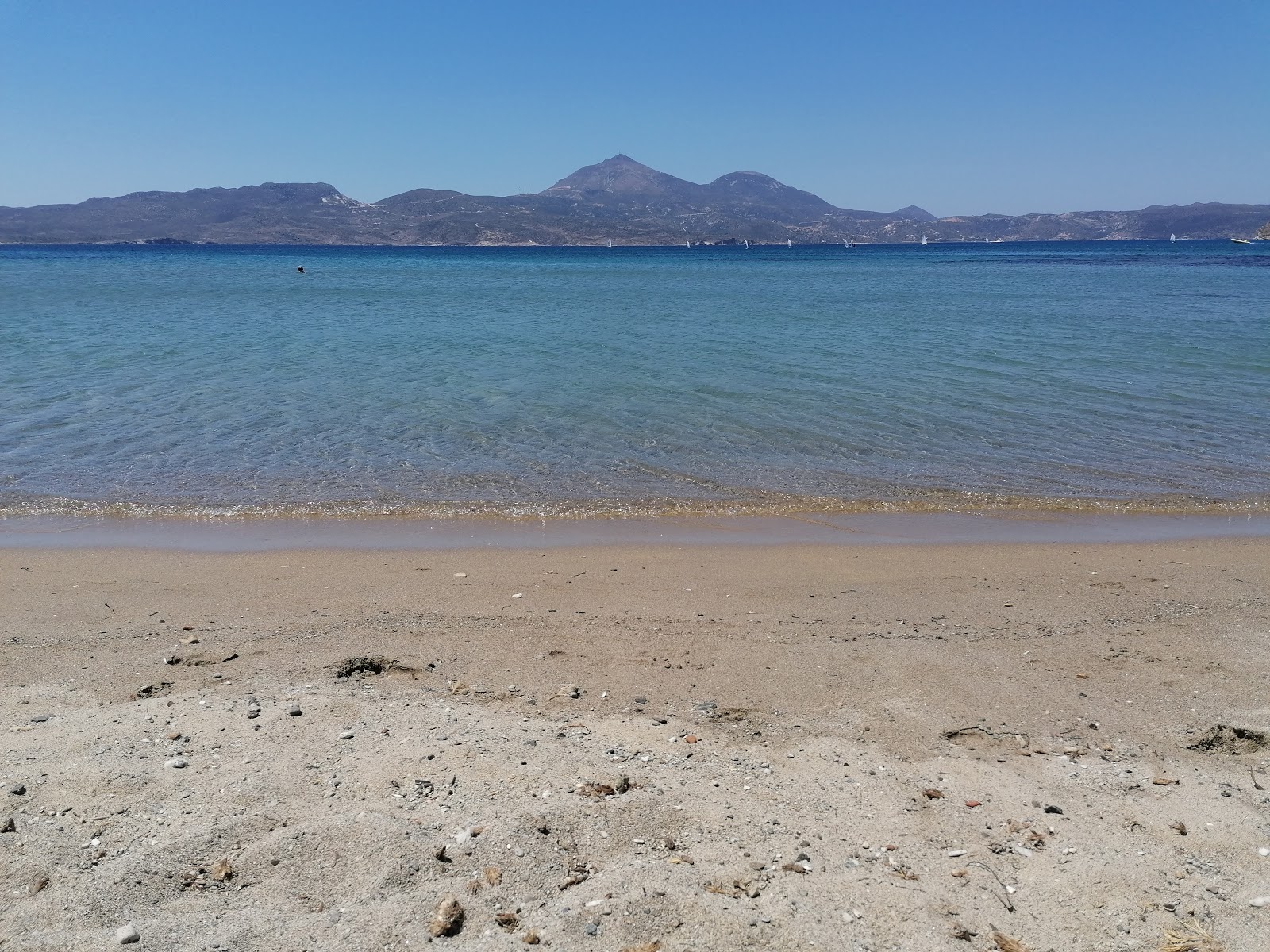 Photo of Papikinou beach with blue pure water surface