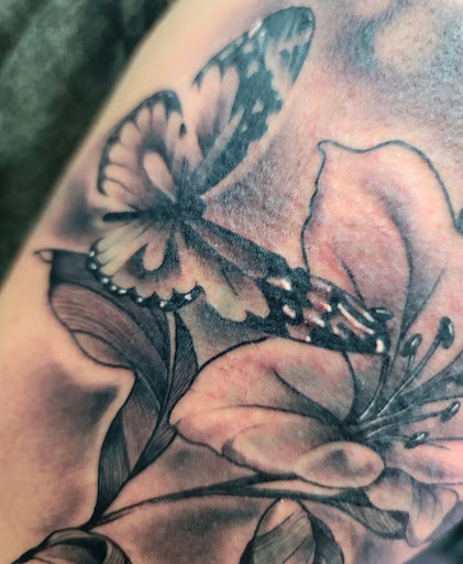 Explore tattoo ideas for adoption, creative tattoo ideas in North Fort Myers, available at Loyal 2 The Coil Tattoos & Body Piercings