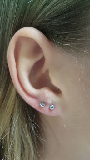 Find tattoo between breast ideas for your next unique tattoo in Aurora at Ronin Tattoo Studio INC