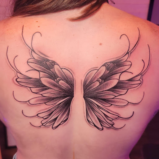 Explore small colourful tattoo ideas, creative tattoo ideas in Chattanooga, available at The Sailors Den Tattoos and Piercing & The Scurvy Pearl Music Venue