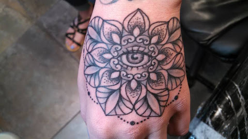 Explore ski mask tattoo ideas, creative tattoo ideas in Redding, available at The Salty Sloth Tattoo