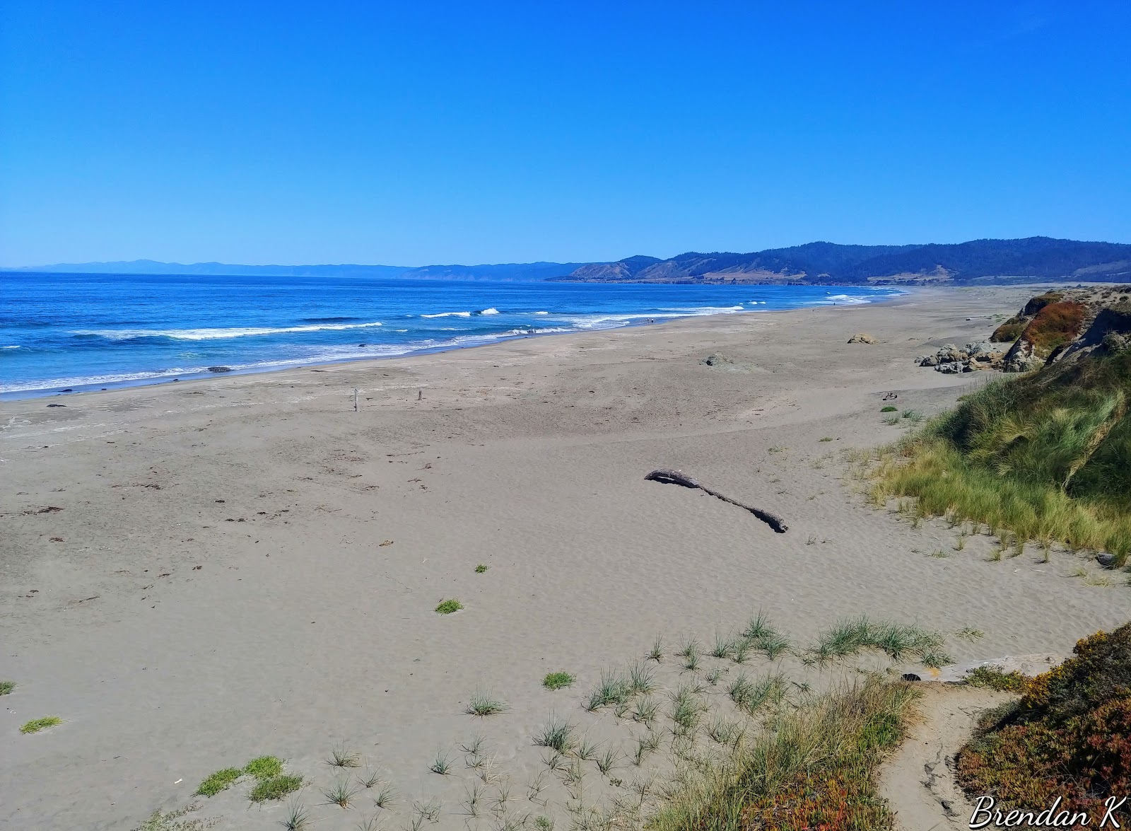 Fotografija Ten Mile Beach z svetel pesek površino