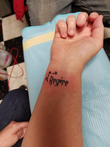 Explore spark plug tattoo ideas, creative tattoo ideas in Montgomery, available at 2Tone Tattoo