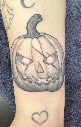 Explore cleavage tattoo ideas, creative tattoo ideas in Eureka, available at Bohemian Tattoo