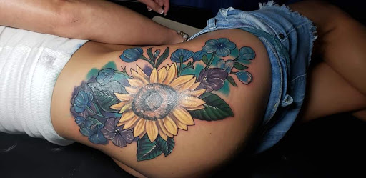 Explore rose tattoo ideas for females, creative tattoo ideas in Ocoee, available at Slaughterized Ink Tattoo and Piercing Studio