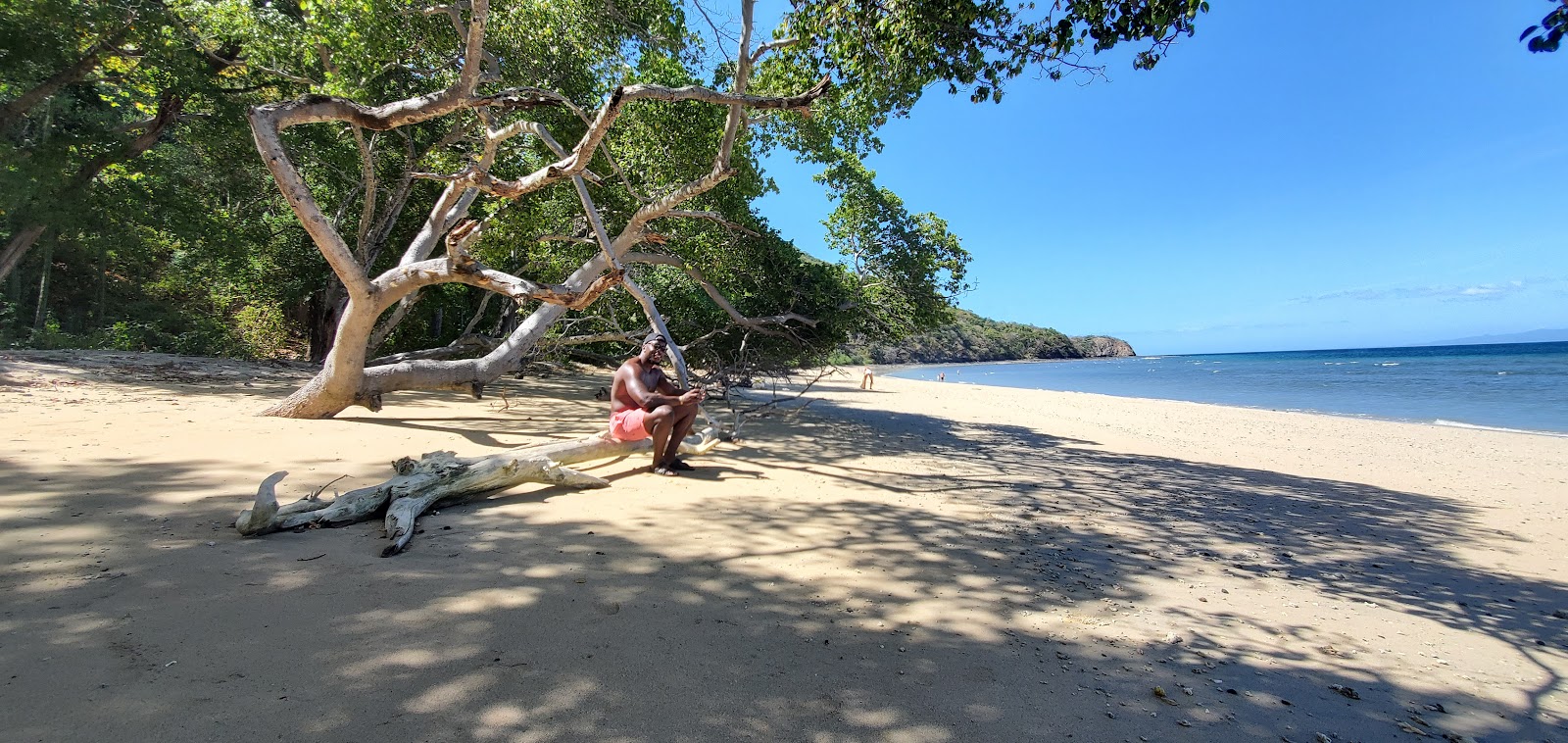 Foto di Tapustxunya Beach con una superficie del sabbia beige fine