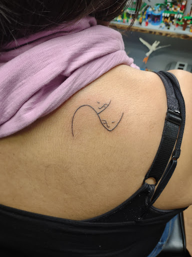 Explore elton john tattoo ideas, creative tattoo ideas in Williamston, available at Inkd Tattoo Parlor