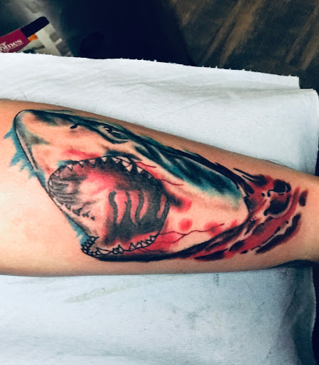 Explore womens neck tattoos ideas, creative tattoo ideas in Jonesboro, available at Gallery Of Ink Tattoo Shop