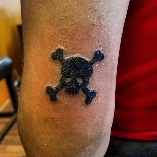 Explore flower tattoo cover up ideas, creative tattoo ideas in Hudson Falls, available at ALTERED ADDICTION TATTOOS