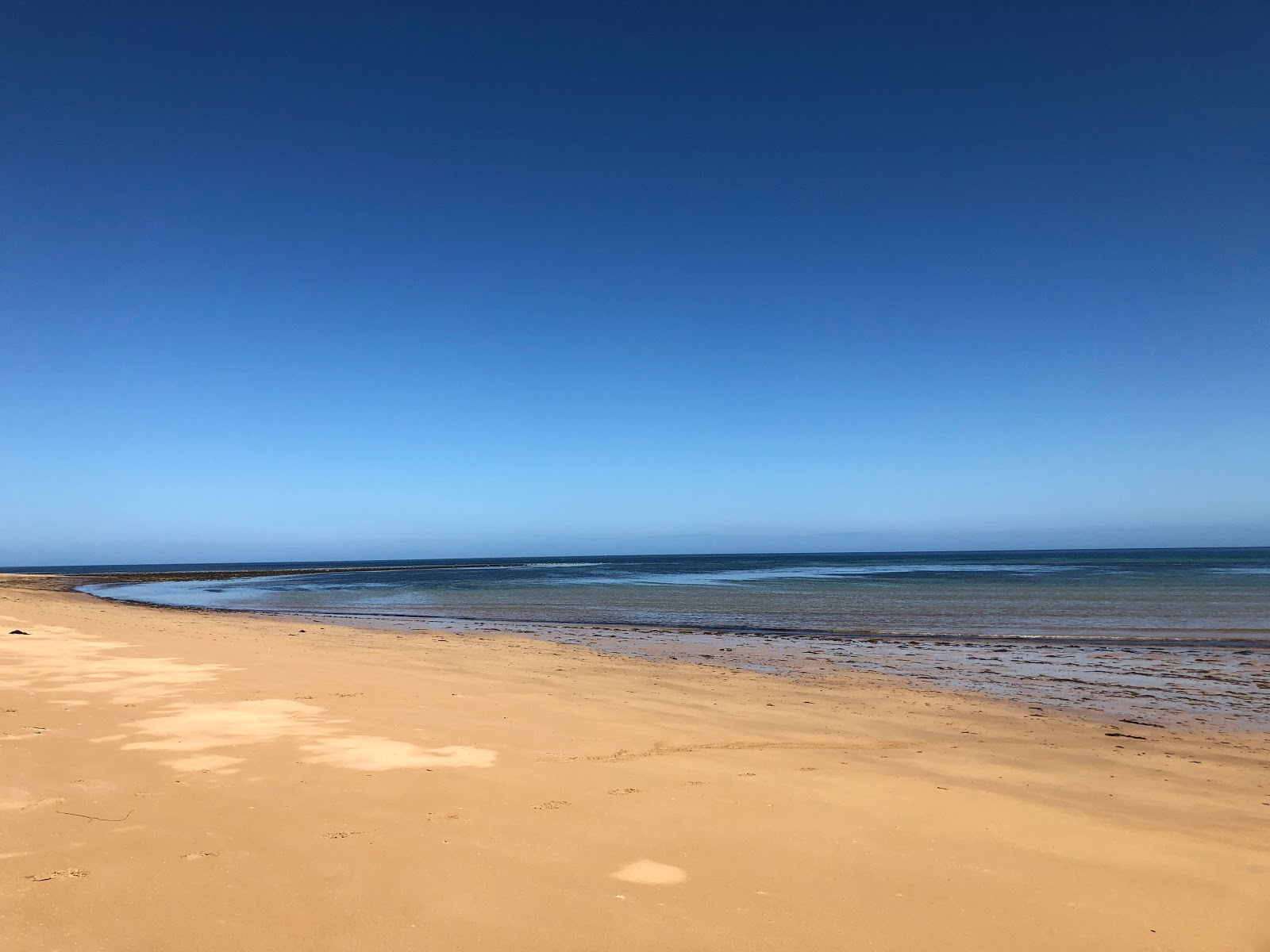 Zdjęcie Rattray Beach z powierzchnią beżowy piasek
