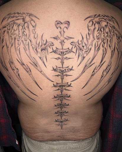 Explore back leg tattoo ideas, creative tattoo ideas in Edison, available at Tattoo Asylum