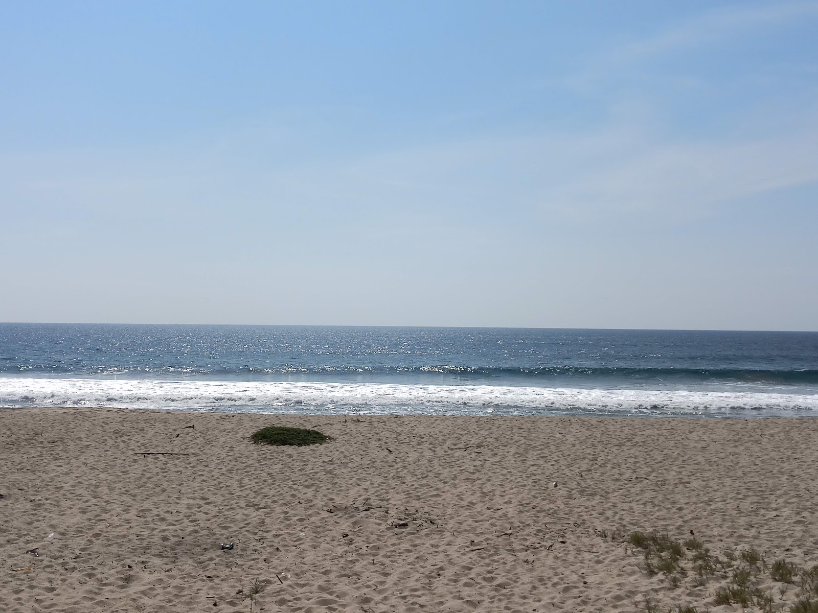 Foto di Playa Paso De La Garrocha con una superficie del sabbia beige