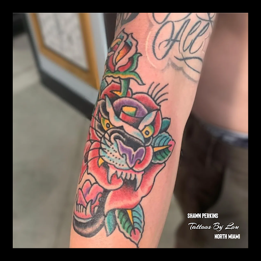 Explore tattoo ideas for women's lower back, creative tattoo ideas in Miami, available at Tattoos by Lou Miami - North Miami