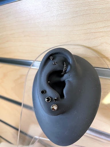 Explore dog collar tattoo ideas, creative tattoo ideas in Kirksville, available at Properly Pierced