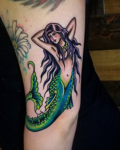 Explore tricep tattoo ideas for men, creative tattoo ideas in Talbott, available at Alpha Tattoo co.