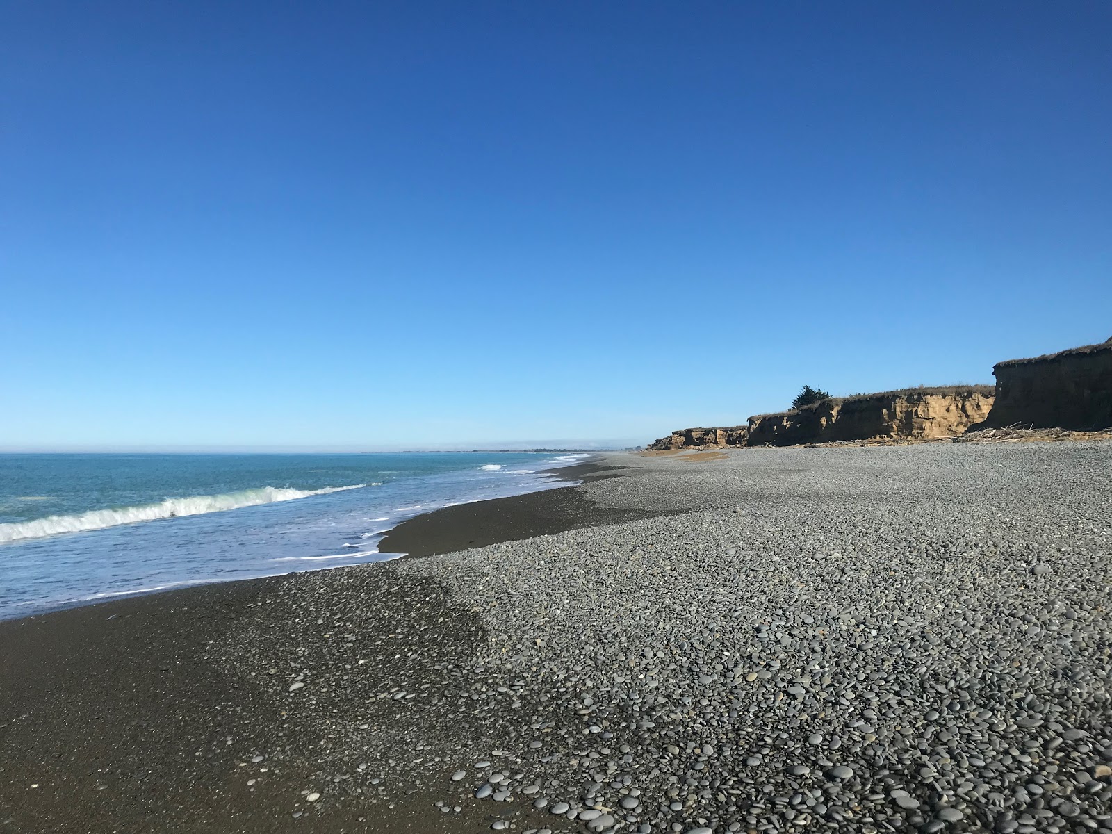 Foto av Occult Beach med grå sten yta
