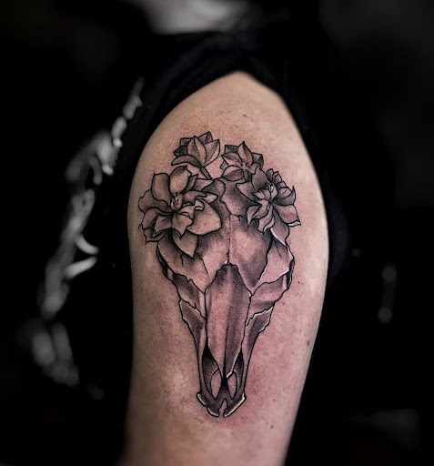 Find between the boob tattoo ideas for your next unique tattoo in Lavonia at 1890 Tattoo Co.