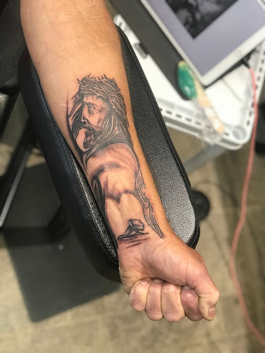 Explore tattoo ideas men upper arm, creative tattoo ideas in Jackson, available at Asylum Tattoo