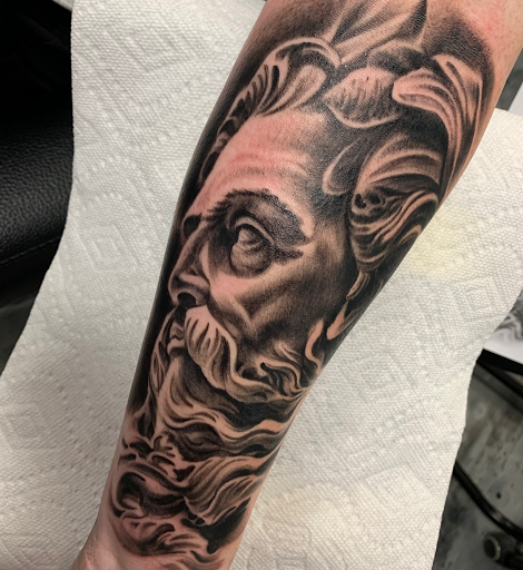 Find crown tattoo ideas for females for your next unique tattoo in Fayetteville at Sacred Raven Tattoo Shop