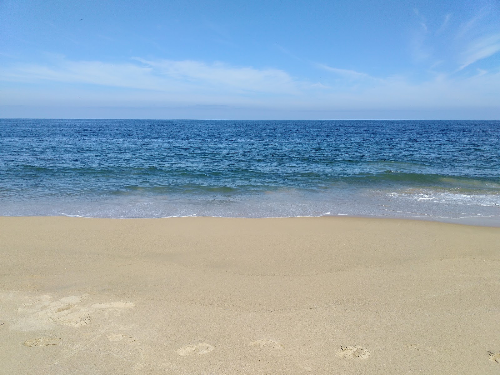 Foto av El Naranjo beach med lång rak strand