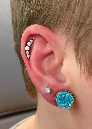 Explore cherub tattoo ideas, creative tattoo ideas in Springfield, available at Body Piercing By Qui Qui