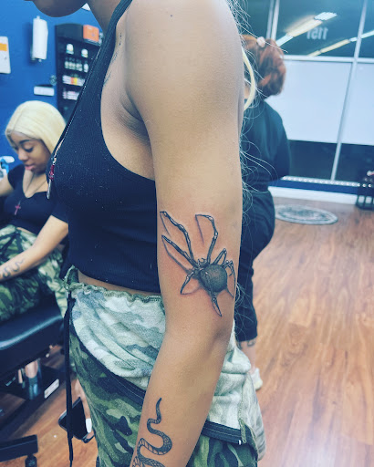 Explore camera tattoo ideas, creative tattoo ideas in Cocoa, available at Rorschach Tattoo Shop and Piercing Studio