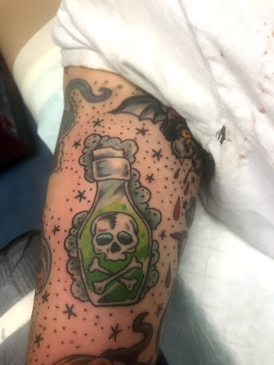 Explore blackout tattoo cover up ideas, creative tattoo ideas in Aurora, available at Ronin Tattoo Studio INC