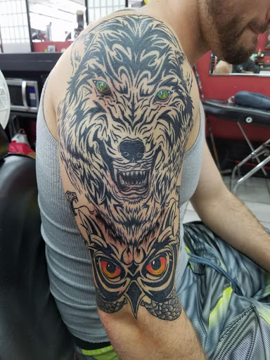 Explore floral tattoo sleeve ideas, creative tattoo ideas in Daytona Beach, available at Studio 21 Tattoo & Piercings Daytona Beach
