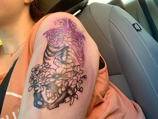 Explore chest tattoo lettering ideas, creative tattoo ideas in Evansville, available at Tattoo Saloon