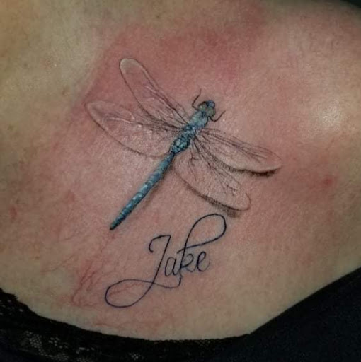 Explore dinosaur tattoo ideas for son, creative tattoo ideas in Nevada, available at Generation X Tattoos and Piercings