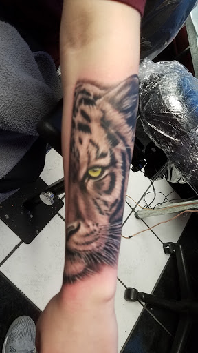 Explore mens tattoo ideas upper arm, creative tattoo ideas in Toledo, available at Steel Addictions