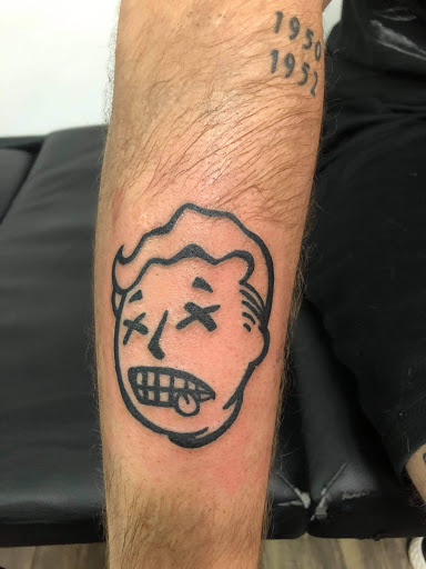 Explore bookworm tattoo ideas, creative tattoo ideas in Goose Creek, available at Red Kirin Tattoo