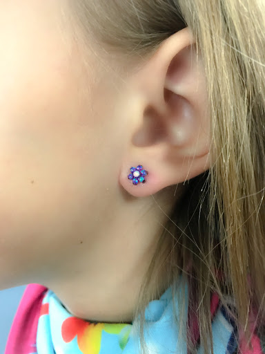 Explore atom tattoo ideas, creative tattoo ideas in Springfield, available at Body Piercing By Qui Qui