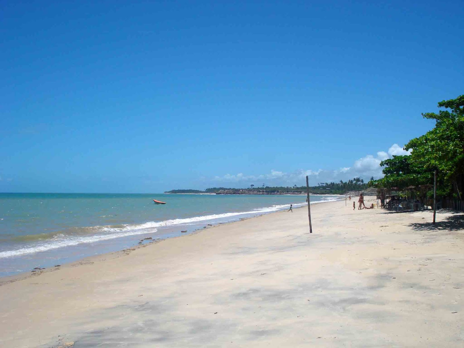 Foto di Corumbau Beach con una superficie del sabbia beige fine