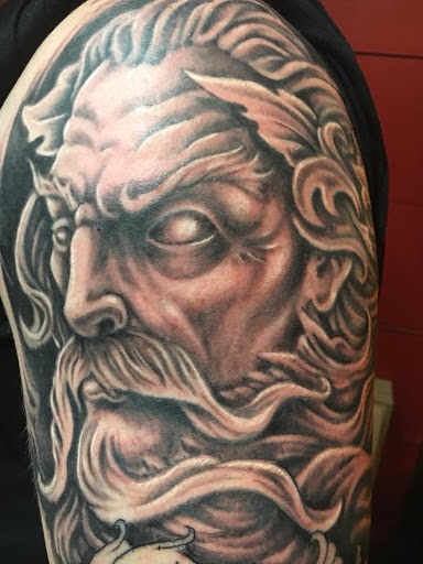 Explore cover up tattoo ideas lower back, creative tattoo ideas in Spring, available at Noble Street Tattoo Parlour