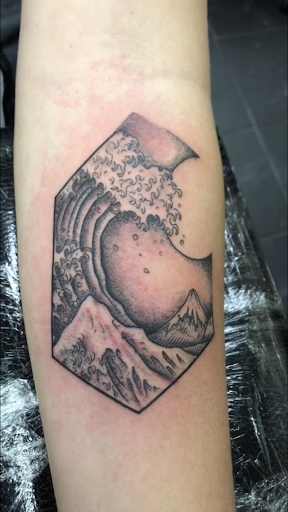 Explore saturn tattoo ideas, creative tattoo ideas in New Braunfels, available at COMAL RIVER TATTOO