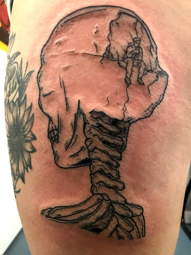 Explore men's ring tattoo ideas, creative tattoo ideas in Muncie, available at The Tattoo Studio