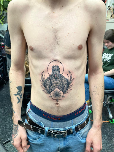 Explore male calf tattoo ideas, creative tattoo ideas in Slippery Rock, available at Dinky Dachshund Tattoo Parlor