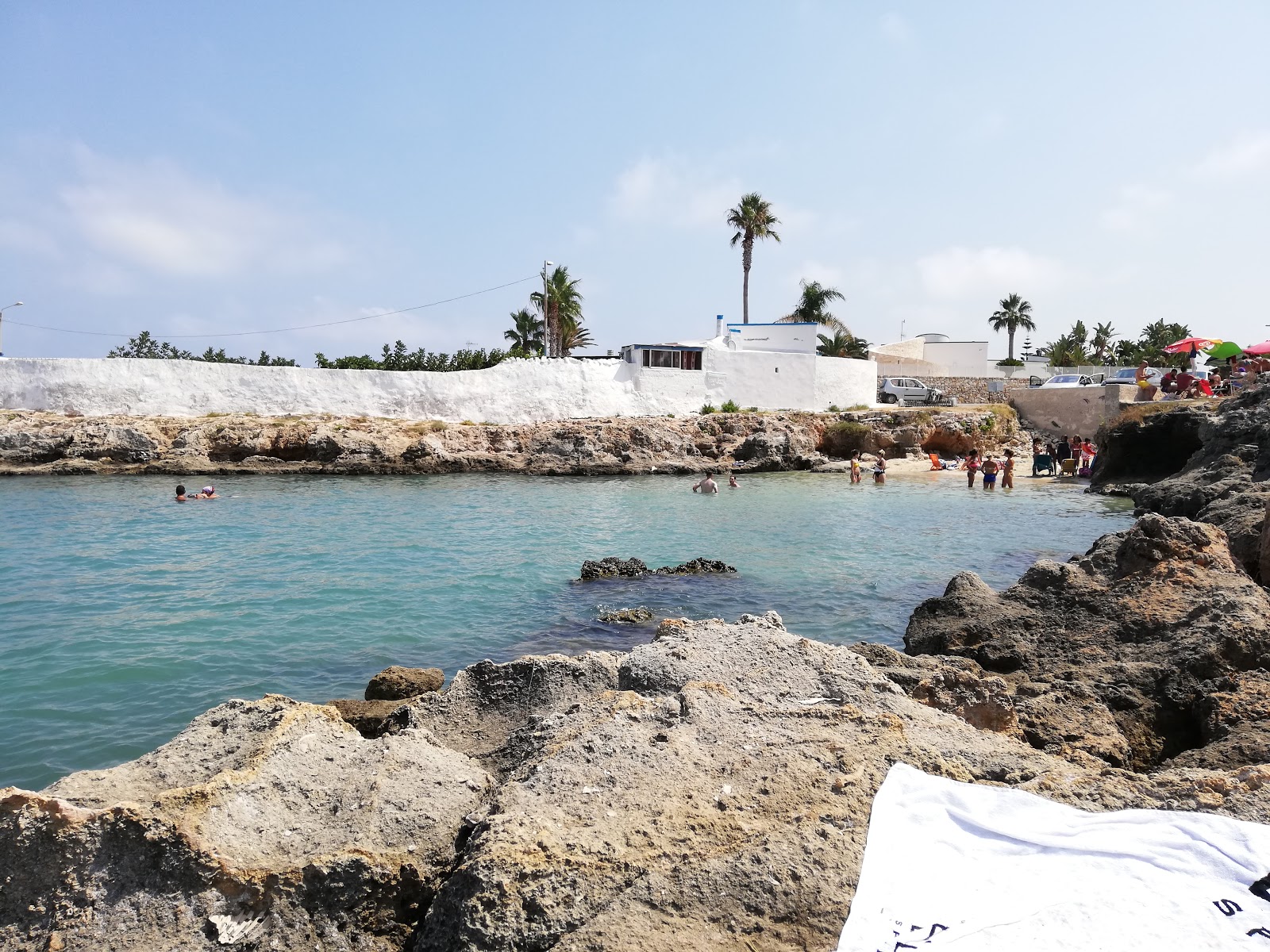 Porto Contessa Beach'in fotoğrafı küçük koy ile birlikte
