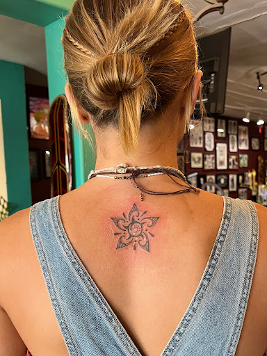 Explore hand tattoo ideas men, creative tattoo ideas in San Diego, available at Sideshow Tattoo and Piercing