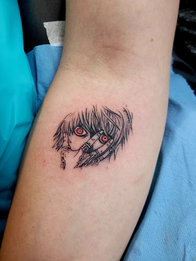 Explore snake sleeve tattoo ideas, creative tattoo ideas in Benton, available at Spectrum Tattoo