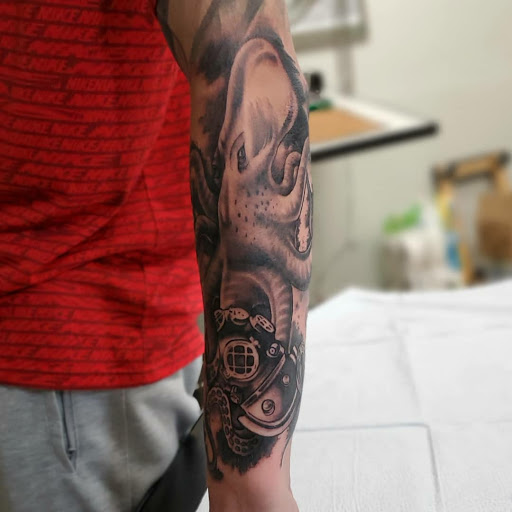 Find dragon arm tattoo ideas for your next unique tattoo in Bakersfield at CLASSIC STANDARD TATTOO CO.