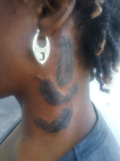 Explore ribbon tattoo ideas, creative tattoo ideas in Hollywood, available at Major Ink Studios
