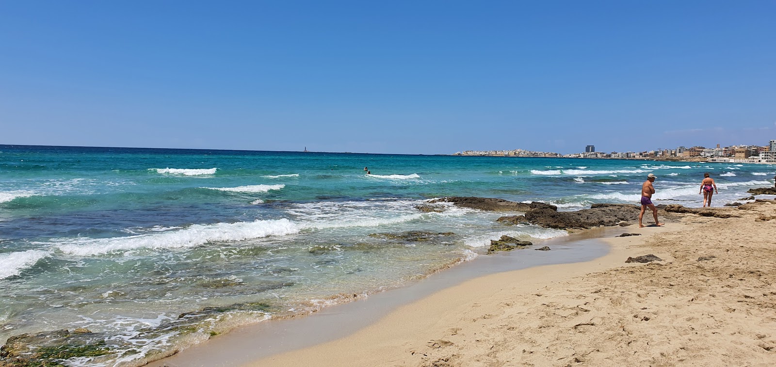 Foto av Spiaggia Gallipoli med blå rent vatten yta