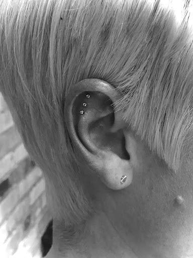 Explore minimalist dog tattoo ideas, creative tattoo ideas in Logan, available at Surreal Ink Tattoo & Body Piercing