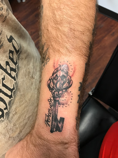 Explore muscle tattoo ideas, creative tattoo ideas in Seymour, available at American Gypsy Tattoo Corp.