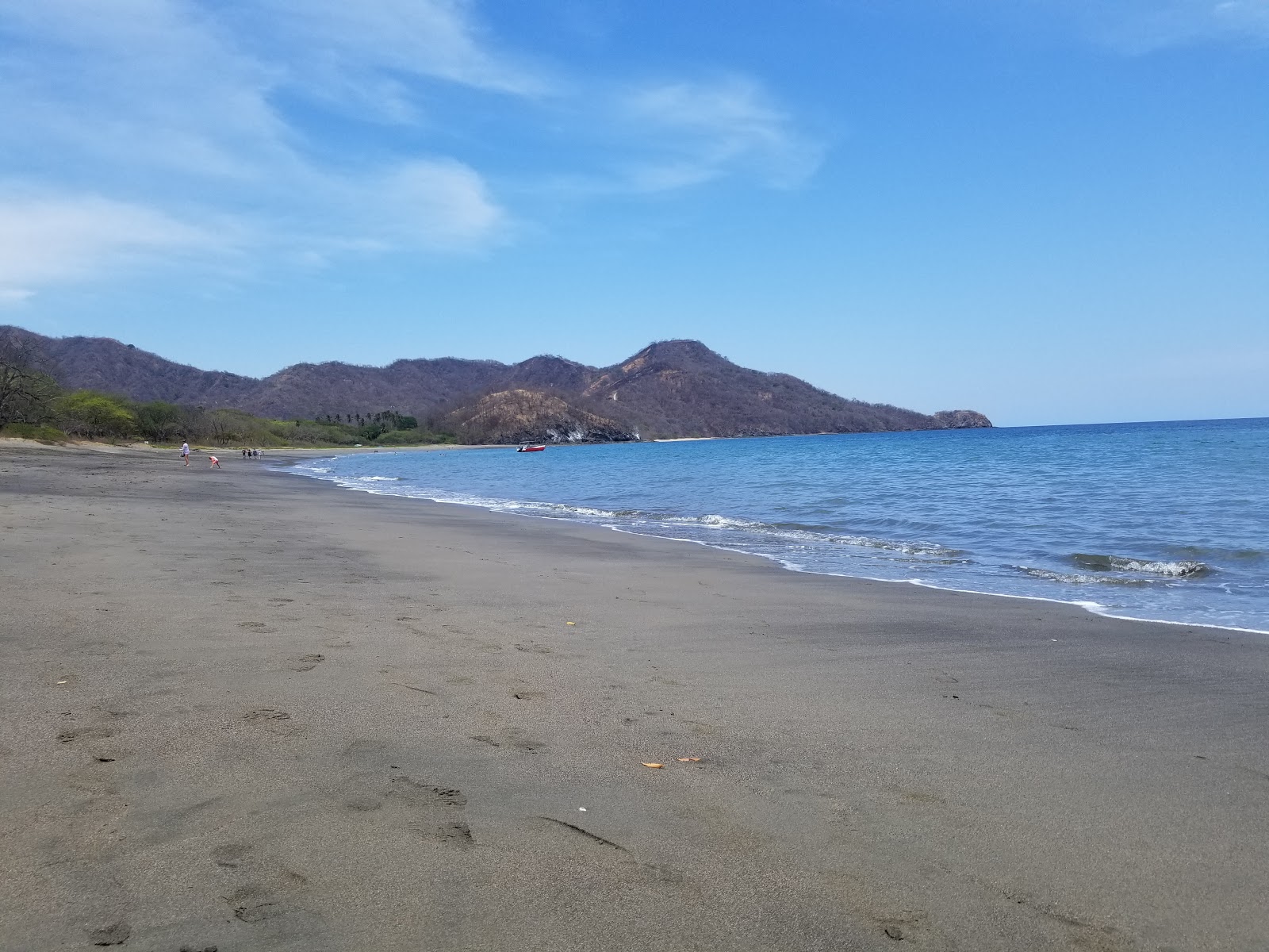 Foto van Matapalo Beach omringd door bergen