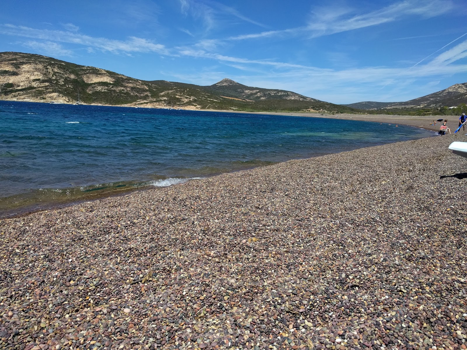 Photo de Astro beach avec l'eau cristalline de surface